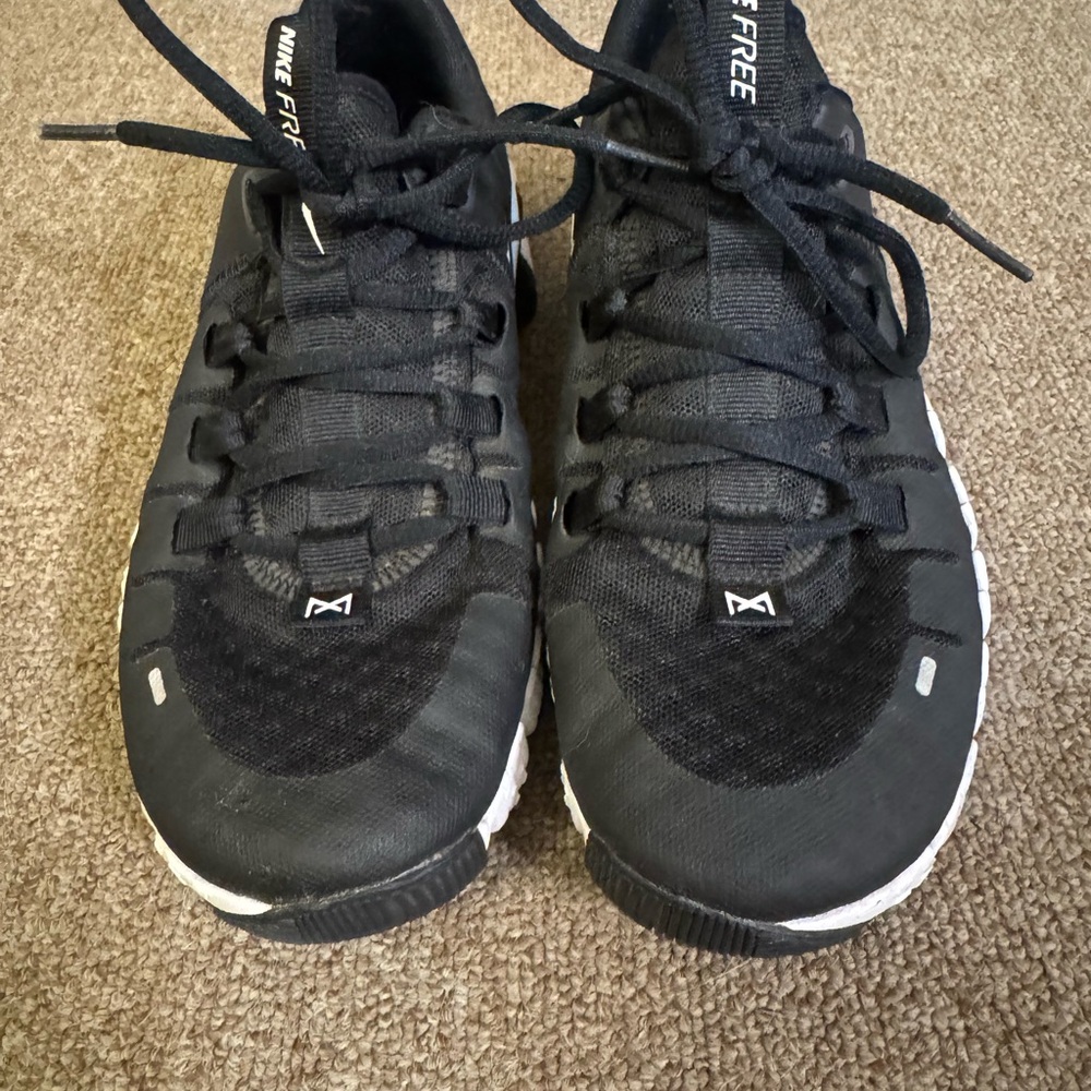 Black and white Nike Metcons